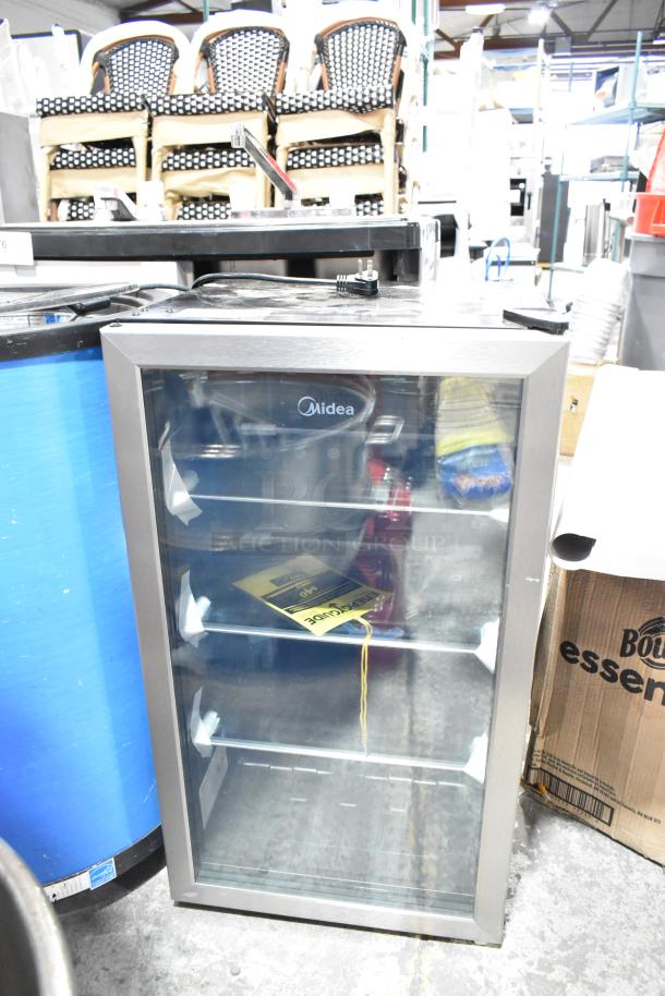 Brand new Midea MRV115S1BST 3.3cu.ft. mini beverage cooler, sleek design, visible shelving, 115V, 1 Phase, scratch and dent condition.