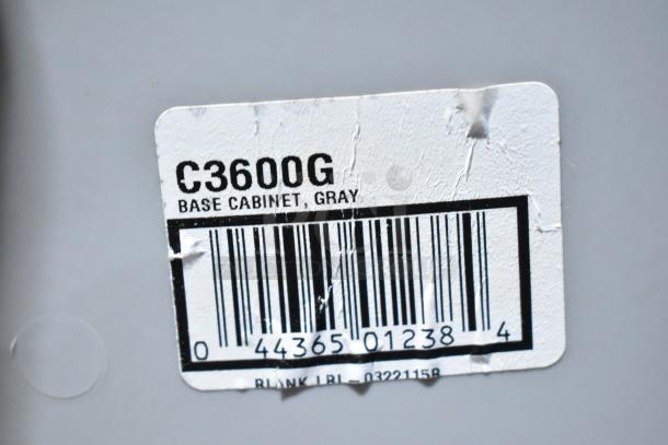 Suncast C3600G 4 Bay Portable Sink, gray base cabinet with label indicating model and barcode.