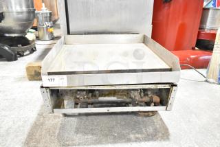 Commercial countertop gas-powered flat top griddle with visible wear and rust. Auction tag marked "177".