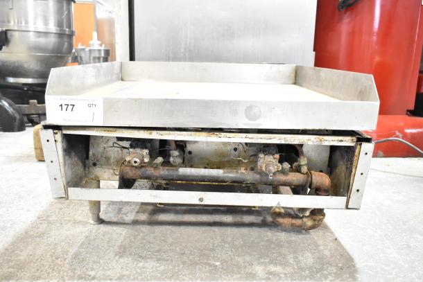 Commercial countertop gas-powered flat top griddle with metal construction, slightly worn. Visible auction tag labeled "177."