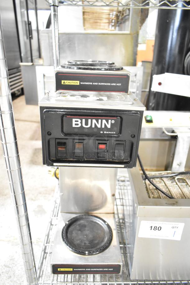 Bunn Commercial 3 Burner Coffee Machine, 115 Volts, 1 Phase, with caution labels, on metal shelving.