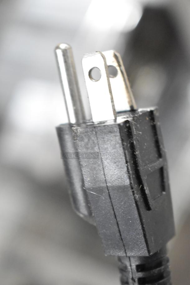 Close-up of a power plug on the Carnival King DFC1800 Funnel Cake/Donut Fryer, 120V, 1 Phase.