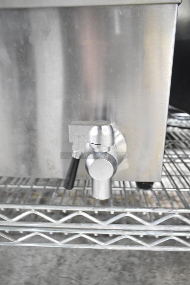 Carnival King DFC1800 25 lb. funnel cake donut fryer detail, showing valve and stainless steel build, 120V, good condition.