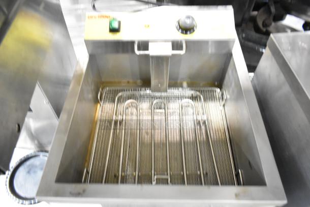 Carnival King DFC1800 25 lb. Funnel Cake/Donut Fryer, 120 Volts, shown in used condition with visible heating elements.