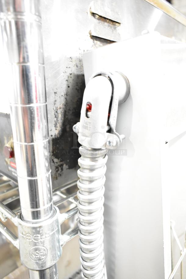 Hatco GRAH-60 60" Glo-Ray infrared food warmer, showing power connection. Features durable metal construction.