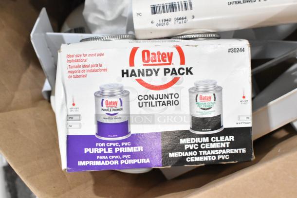 Oatey Handy Pack, including purple primer and medium clear PVC cement, ideal for most pipe installations. Model #30244.
