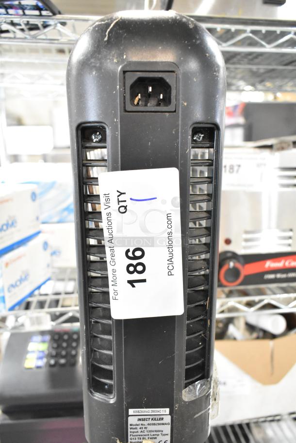 Zap N Trap Bug Zapper, 120 Volts, 1 Phase. Visible tag reads "186" for auction identification. In working condition.