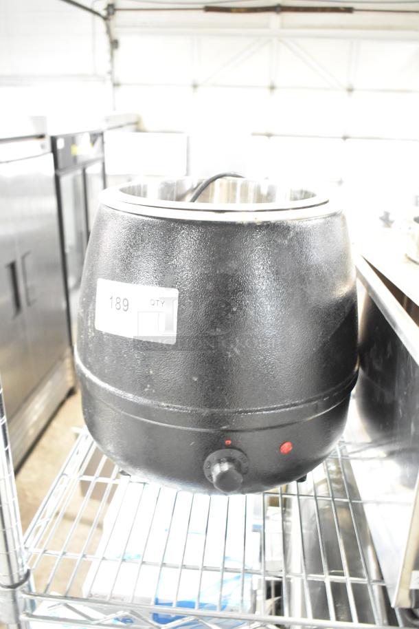 Glenray 102180 soup kettle food warmer, black, 120V, in used condition on a metal shelf. Visible label shows "189 QTY."