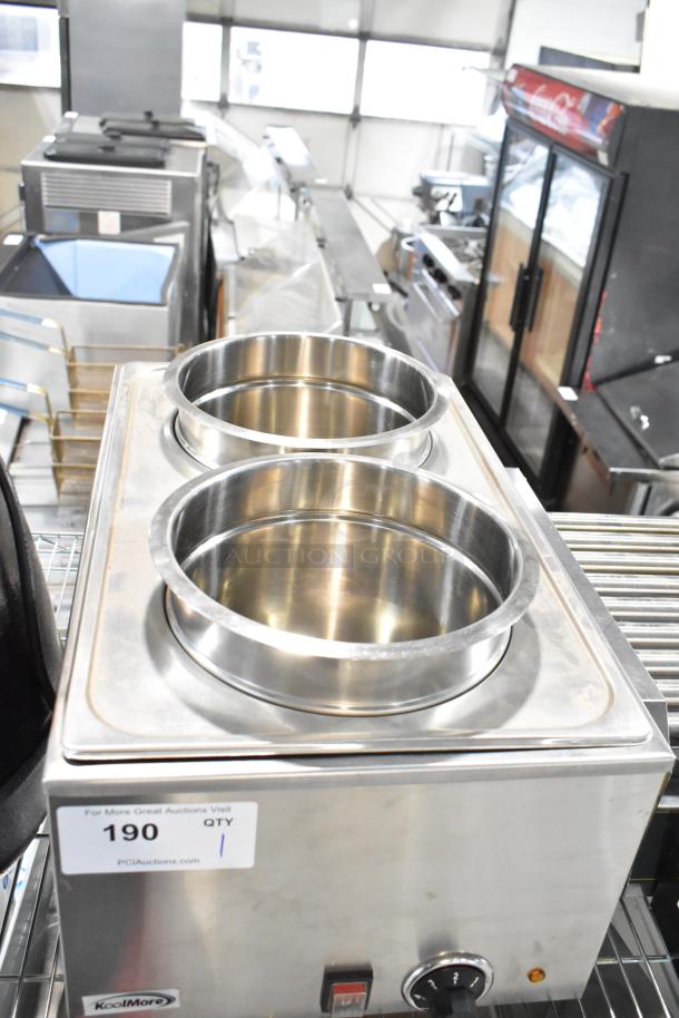 Brand new 2023 KoolMore VFW-4 commercial countertop food warmer, scratch and dent, 110 volts, 1 phase, in a storage setting.