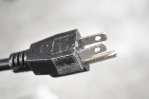 Close-up of a power plug for a 2023 KoolMore VFW-4 Commercial Countertop Food Warmer, 110 Volts, 1 Phase.