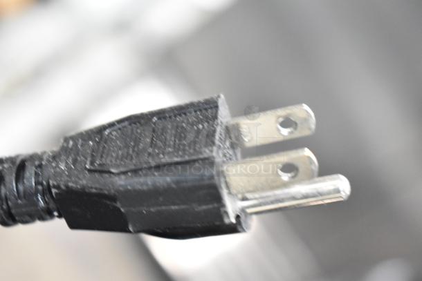 Close-up of a power plug for the 2021 Carnival King 382HDRG24 Commercial Countertop Hot Dog Roller, 120 volts.