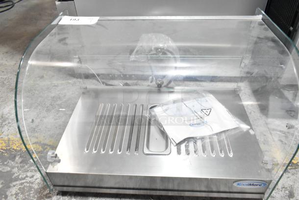 Brand new KoolMore HDC-1.5C curved glass countertop display warmer, 1.5 cu. ft., 110-120V, with scratches and dents.