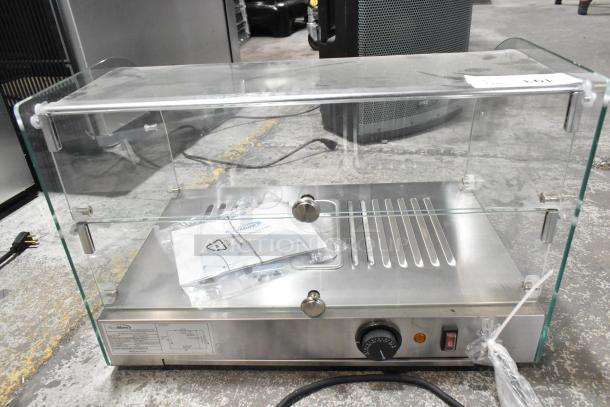 Brand new KoolMore HDC-1.5C countertop display warmer, 1.5 cu. ft., curved glass, includes manual; slight cosmetic dents visible.