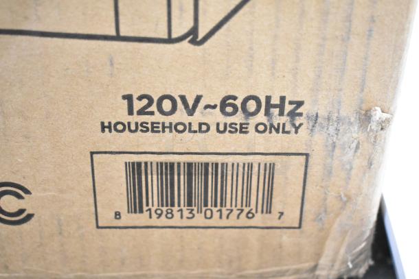 Cardboard box showing specifications for a 120V, 60Hz Commercial Chef Countertop Microwave. Some scratches present.