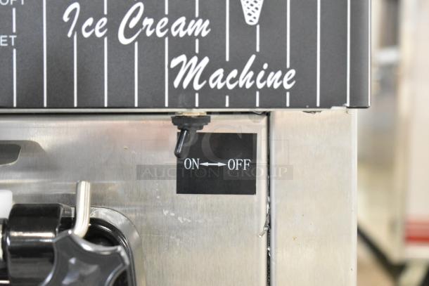 Vevor YKF-8218T soft serve ice cream machine, 2 flavors with twist, stainless steel, counter model, 110V, on/off switch visible.