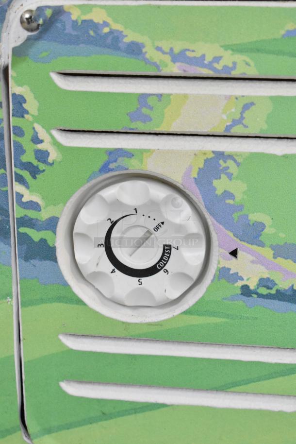 Arctic Air ST07G2 chest freezer control dial, showing temperature settings from off to coldest, on painted panel.