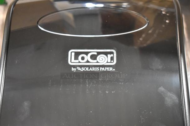 Brand new LoCor D68006 wall mount dispenser with minor scratches. Black finish. "LoCor by Solaris Paper" label visible.