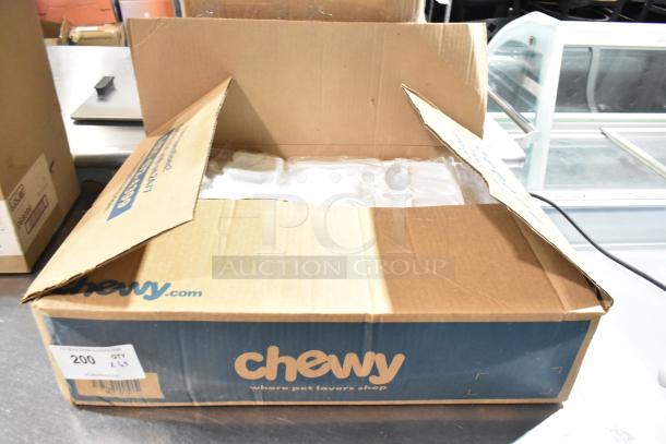 Box of popsicle molds labeled "BRAND NEW SCRATCH AND DENT," in opened Chewy.com box. Mold quantity: 200.