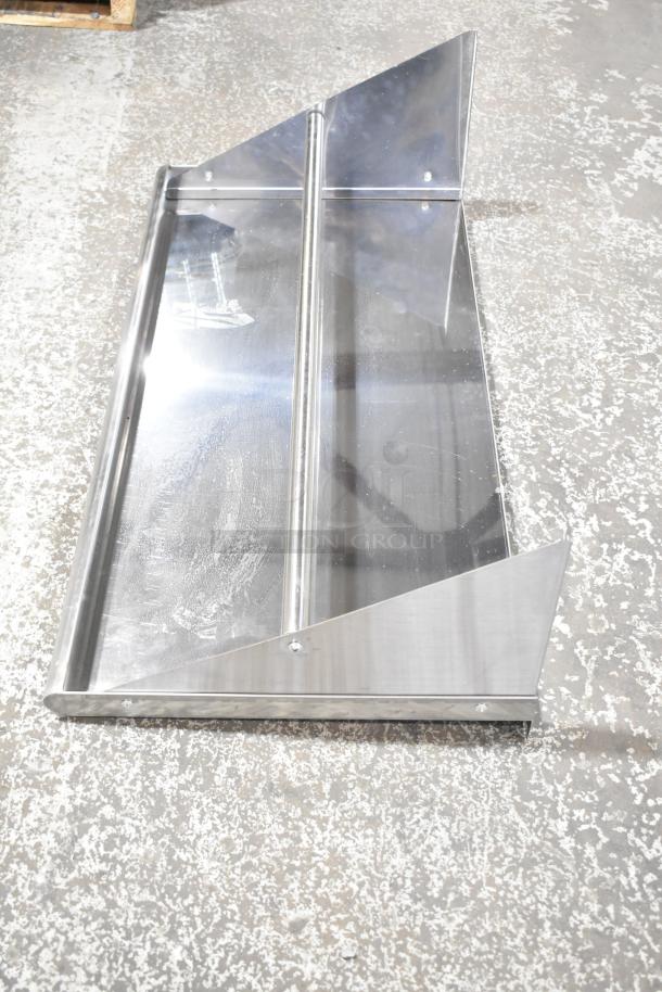 Stainless steel wall mount shelf with a polished finish, featuring two vertical support panels and a flat surface.