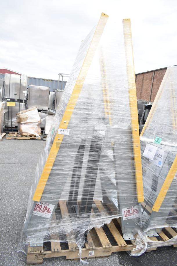 Brand new scratch and dent aluminum crossover steps with steel parts, model MAR26-163, wrapped on pallets.