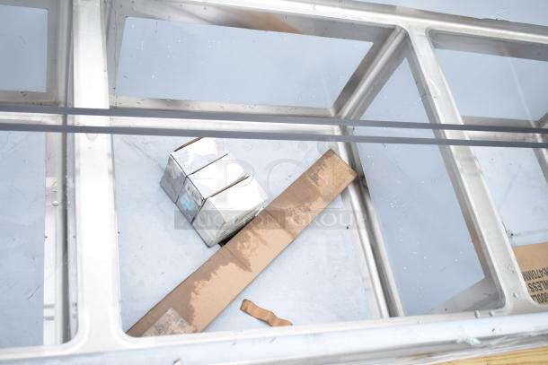 BRAND NEW Regency 600S32424224 3 Bay Sink with dual drain boards, stainless steel, commercial use, visible packaging.