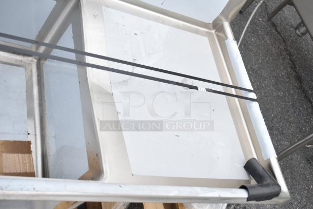 BRAND NEW SCRATCH AND DENT! Regency 600S32424224 3-bay sink with dual drain boards, minor surface scratches visible.