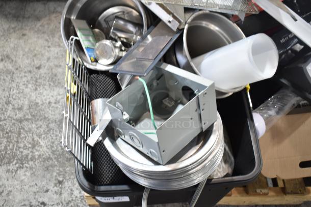 Pallet lot with metal round pans, cylindrical bins, and white baskets in assorted conditions.