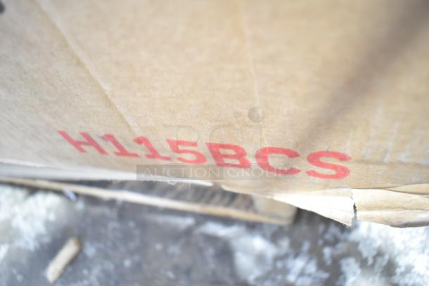 Brown cardboard box labeled "H115BCS" containing a Honeywell H115BCS 115 Can Cooler, brand new with scratch and dent.