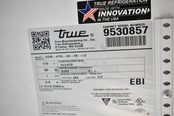 2019 True GDM-41SL-60-HC-LD cooler label; model, voltage, refrigerant info visible. Made in USA, serial number 9530857.