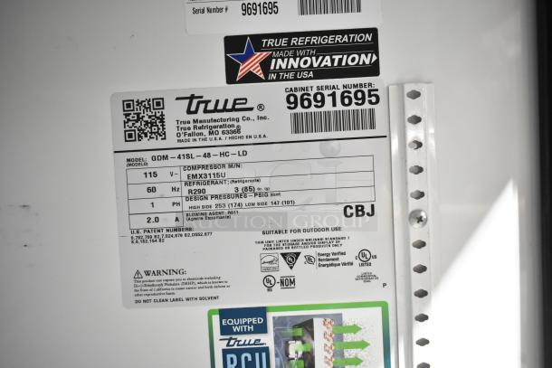 2019 True GDM-41SL-48-HC-LD commercial reach-in cooler, 2 doors, model label and specifications shown, 115 volts, 1 phase.
