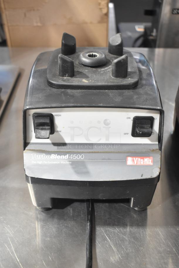 2 Vita-Mix VM0102/VM0103 blenders, no lids, show wear. TurboBlend 4500 label visible. Tested, does not power on.
