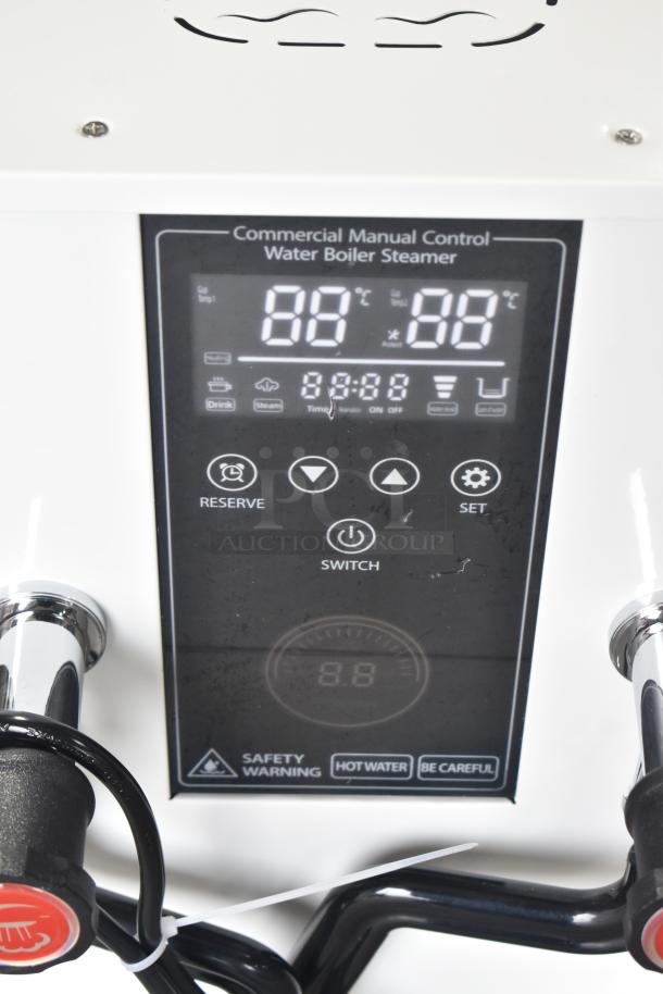 Commercial steam milk frother with manual control; features digital display, switches, and safety warnings; new, minor dents present.