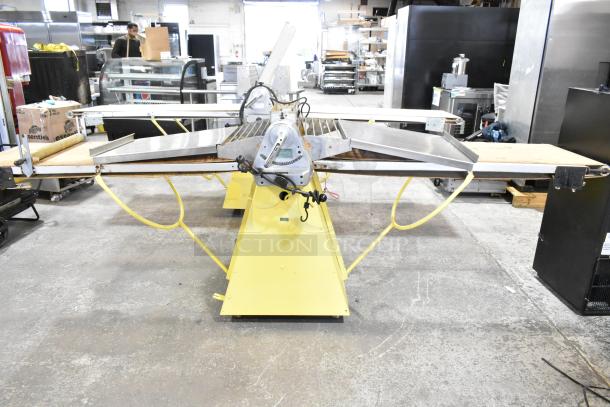 Rondo Seewer commercial reversible dough sheeter, floor model, good condition, stainless steel surfaces, industrial setting.