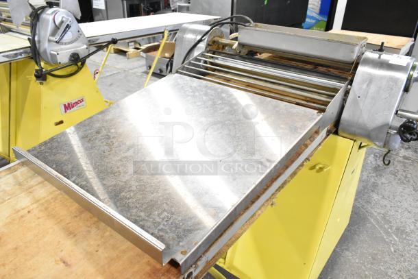 Rondo Seewer commercial reversible dough sheeter in fair condition, featuring a steel conveyor and manual controls.