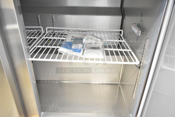 Brand new Avantco 178SSPT488 sandwich salad prep table, scratch and dent, with shelving and documentation inside.