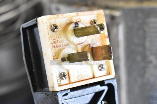 Close-up of a plug associated with a Turbochef HHD oven, showing UL listing, "PLUG 231A," and "50A 250V" markings.