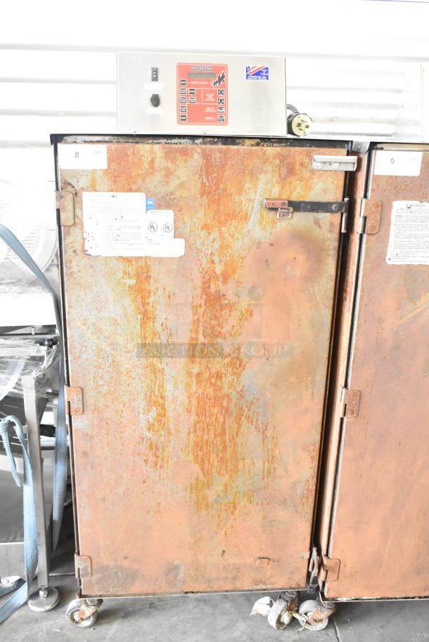 Cookshack 250 Commercial Electric Smoker, stainless control panel, visible rust on cabinet, 208V, on commercial casters.