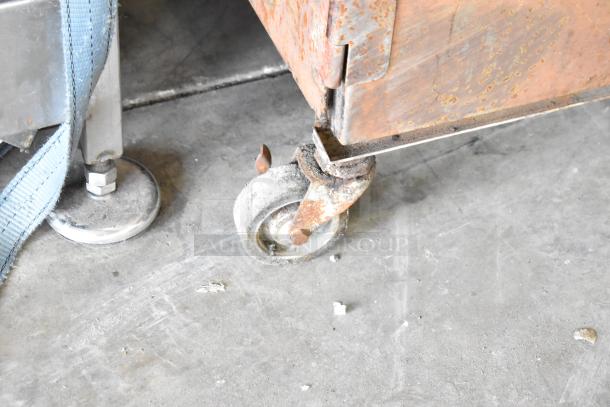 Cookshack 250 Commercial Electric Smoker Cabinet on worn commercial casters, 208 volts, visible rust and wear on metal surface.