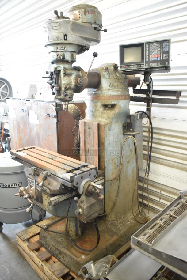 Bridgeport metal milling machine with Turnvision monitor, worn condition. Operates on 208/220/440 volts.