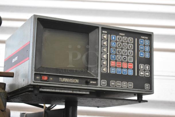Bridgeport metal milling machine with Turnvision monitor, 208/220/440 volts, commercial floor style, visible control panel.