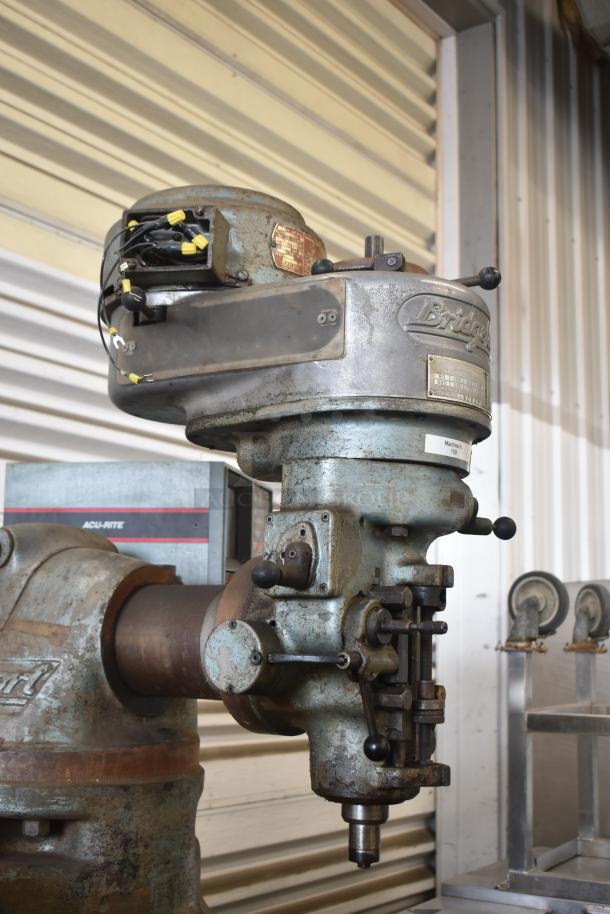 Bridgeport metal commercial floor milling machine with Turnvision monitor, 208/220/440 volts. Moderate wear, metal finish.