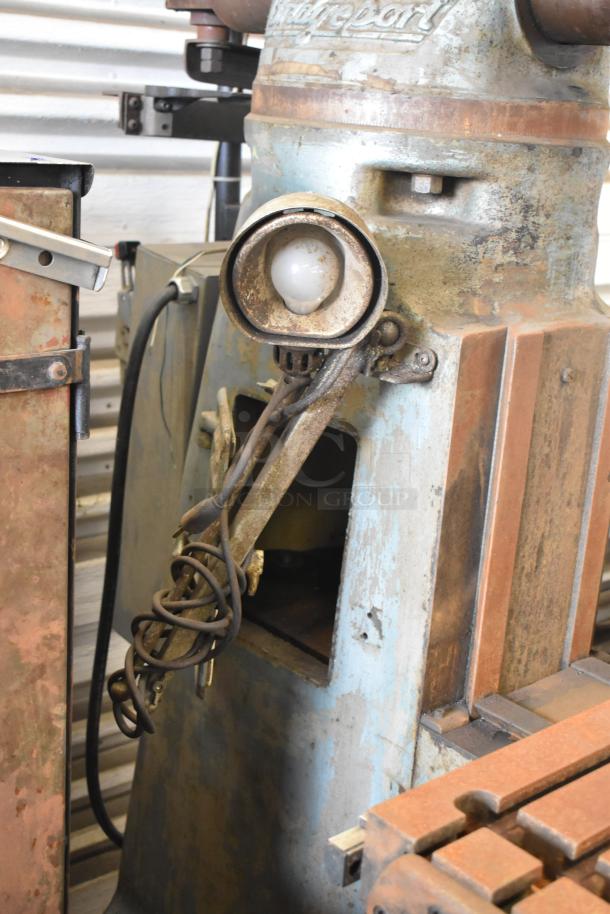 Bridgeport Metal Commercial Floor Milling Machine with Turnvision Monitor. Visible rust and wear. 208/220/440 volts.