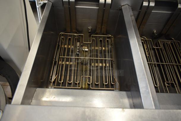 Frymaster FMRE217SC 2-bay electric fryer with dumping station, filtration, and commercial casters. Good condition.