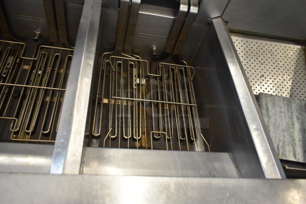 Frymaster FMRE217SC 2 Bay Deep Fat Fryer with dumping station and filtration, on commercial casters, shown in used condition.