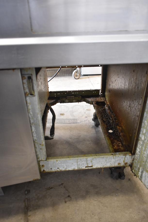 Frymaster FMRE217SC electric fryer, 2 bays, dumping station, filtration, on commercial casters, visible corrosion, fair condition.