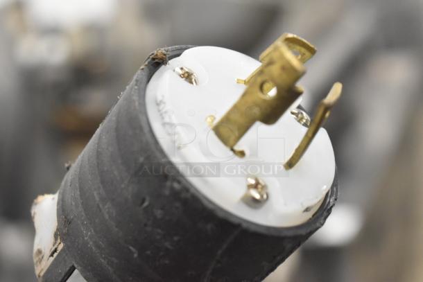 Close-up of a Hussmann MDN3575B1A cooler plug, showing a three-prong configuration for a 120V, 1-phase connection.