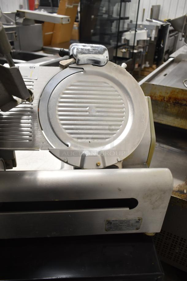 Globe 3600 Commercial Meat Slicer, stainless steel, 120 volts, 1 phase. Features adjustable blade, visible model label.