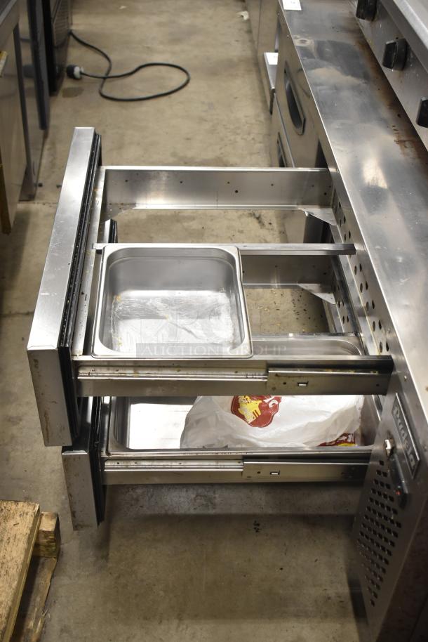 Padela Commercial 4 Drawer Chef Base on casters, stainless steel, with visible drawers open, 115 volts, 1 phase.