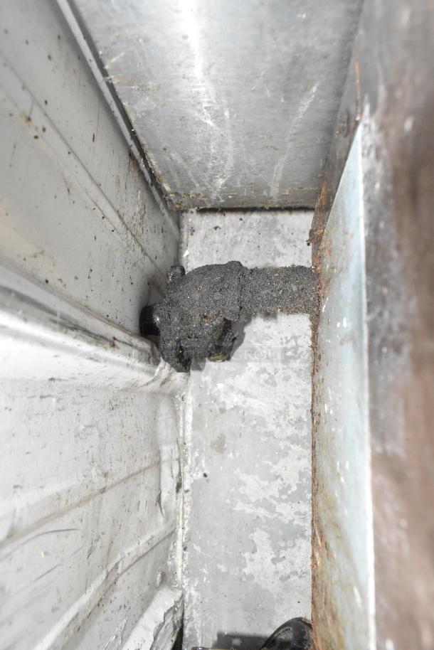 RocketCooking Commercial Gas Charbroiler Griddle, showing internal grease accumulation, indicating cleaning needed.