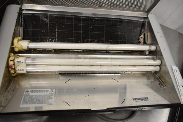 Bag Zapper unit with two fluorescent tubes, 115 Volts, 1 Phase. Visible debris, moderate wear. Serial no. 11401771.